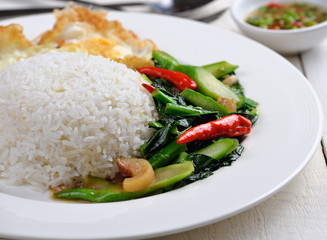 thai food fried kale with crispy pork.