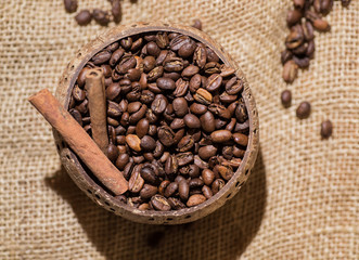 Fototapeta premium coffee beans, cinnamon, old wooden