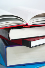 Books stack with book open
