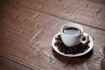 Coffee cup and saucer on wooden table