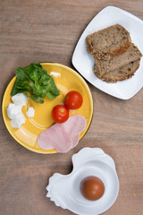 Healthy food for diet as bread salad, tomatoes, eggs, ham,  