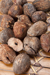 shea nuts near butter on white background