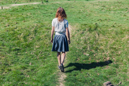 Young woman walking in the countryside