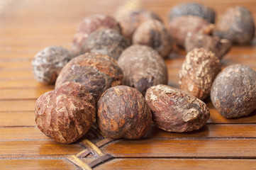shea nuts near butter on white background