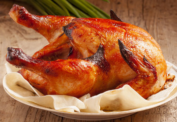 baked chicken on a plate with pita bread