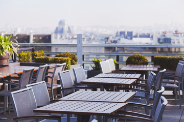 rooftop cafe, open terrace with wooden tables