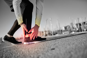 Broken twisted ankle - running sport injury. Athletic man runner