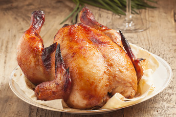 baked chicken on a plate with pita bread