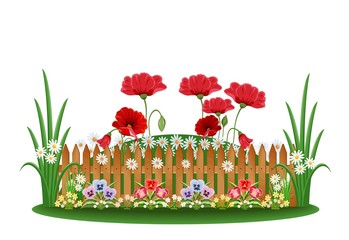Beautiful bed with different flowers and a wooden fence
