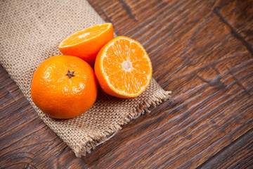 Obraz na płótnie Canvas Tangerines on wooden table