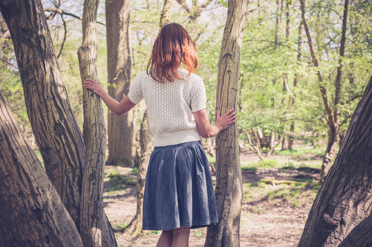 Young woman exploring a forest