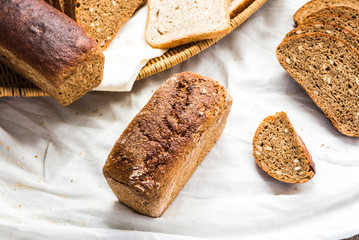 assortment of baked bread, slices of rye bread, bran cereal, rus