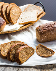 assortment of baked bread, slices of rye bread, bran cereal, rus