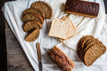 assortment of baked bread, slices of rye bread, bran cereal, rus