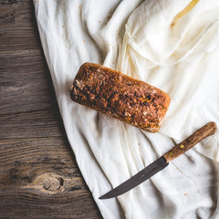 Assorted bread, slices of rye bread on linen tablecloths, wooden