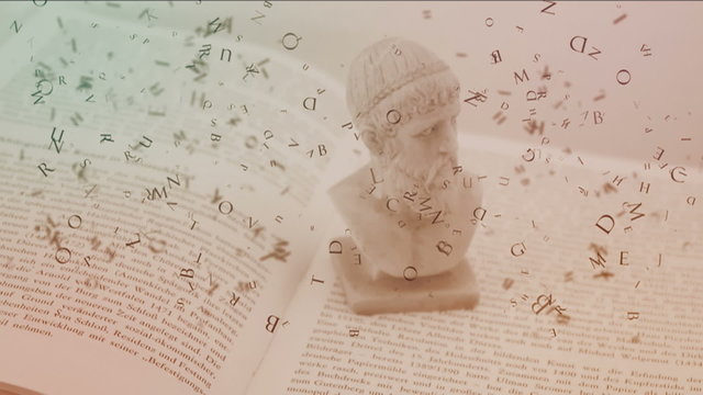 Open book with falling letters and sculpture of ancient head.