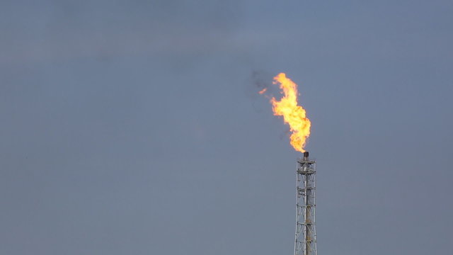 Fire from flare structure in petrol chemical plant in day time