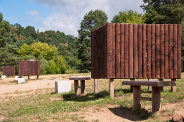 Fototapeta na wymiar Wooden Dressing Cabins and Benches in Nature