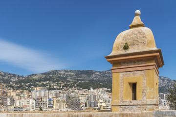 Obraz premium Monaco with a tower and the wall of the old city in the foregrou
