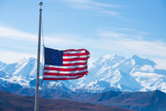 usa flag with mount mckinley in background, denali national park