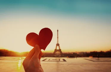 Fototapete Rund beautiful vintage card from Paris, Eiffel tower and hand with paper heart at sunrise © Song_about_summer
