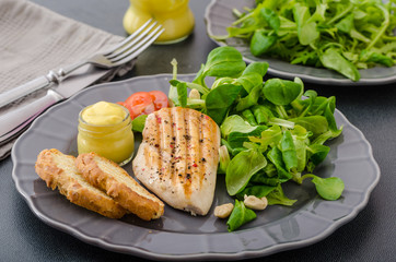 Grilled chicken with salad and nuts