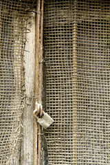 Rusty metal net and rusty padlock 18