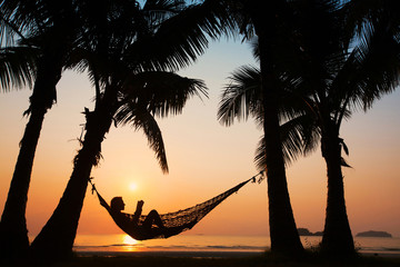 woman in hammock on the beach