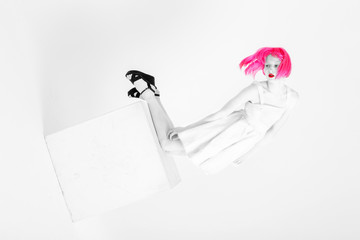 Fashion black and white photo of beautiful woman with pink hair