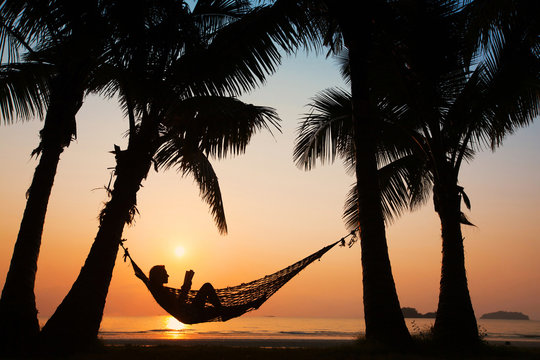 Woman In Hammock On The Beach