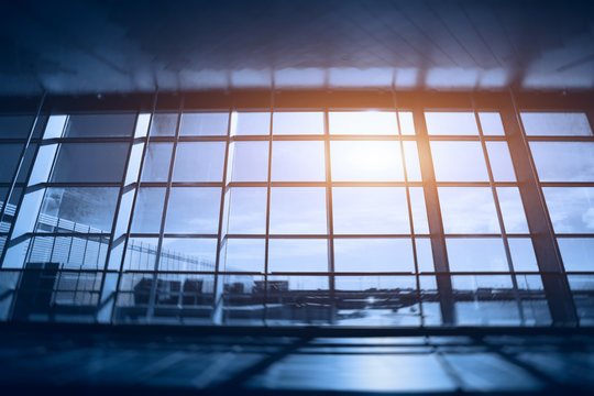 glass wall in the airport, blurred abstract business interior