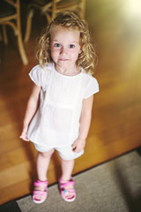 Little girl smiling at home