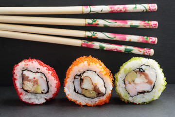 Sushi on a background of Japanese chopsticks