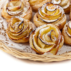 Puff pastry with apple shaped roses on white background