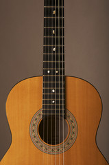 Fototapeta na wymiar Studio detail photograph of an acoustic spanish classical guitar