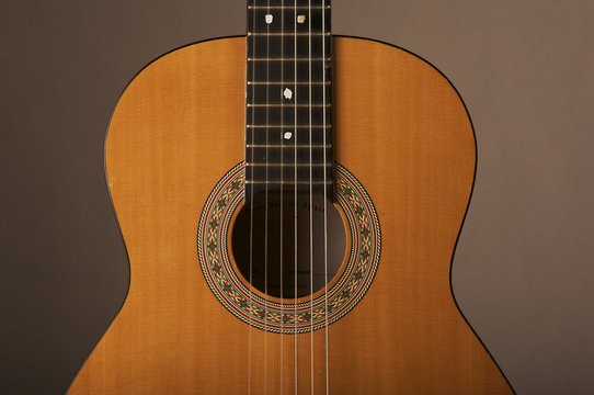 Studio detail photograph of an acoustic spanish classical guitar