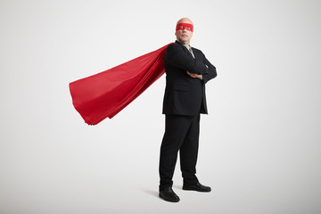 senior businessman dressed as a superhero - Powered by Adobe