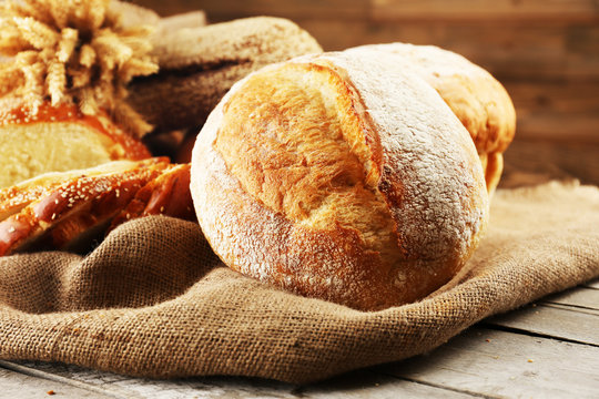 Different bread with ears on sackcloth background