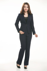 Obraz premium Young Asian women wearing a suit in front of a white background