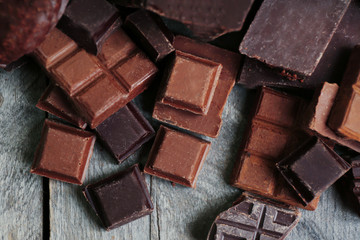 Set of chocolate on wooden table, closeup