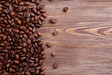 Fototapeta premium Coffee beans on wooden background