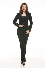 Fototapeta premium Young Asian women wearing a suit in front of a white background