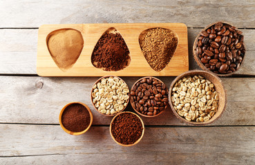 Various of coffee in small dishes on wooden table, top view