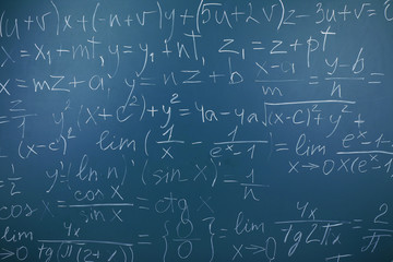 Maths formulas on chalkboard background