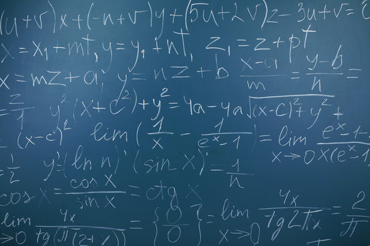 Maths formulas on chalkboard background