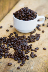 Fototapeta na wymiar Coffee beans background on wooden, Fresh coffee beans