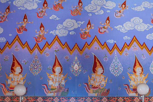 Thai buddhist paintings of dieties on the temple walls