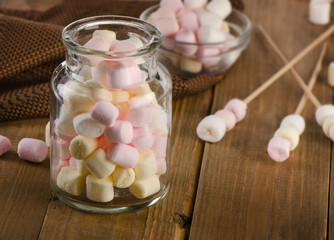 Sweet marshmallows in a glass jar.