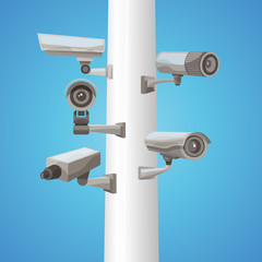 Naklejka na ściany i meble Surveillance Camera On Pillar