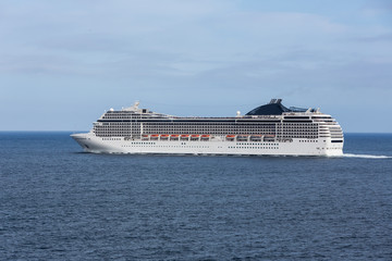 Fototapeta na wymiar Cruise ship leaving the harbor of Funchal at Madeira Island